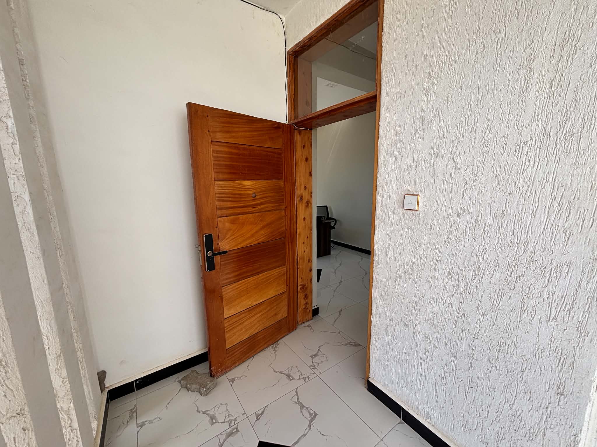Solid wood front door at the entry