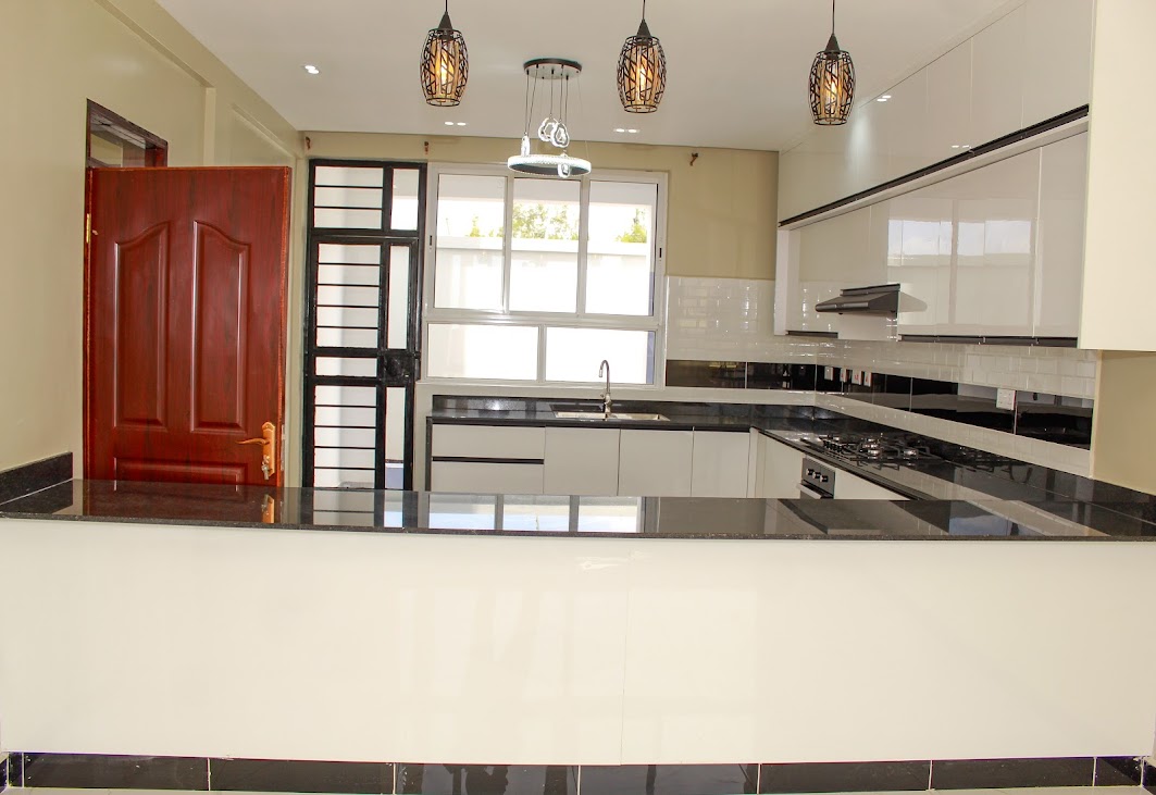 Modern fitted kitchen with granite countertops